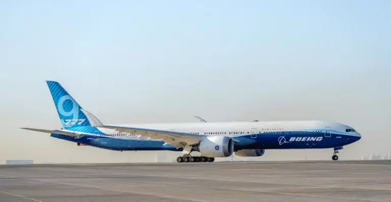 Boeing 777-200 widebody aircraft in flight, featuring its twin-engine design, long-range capability, and spacious passenger cabin.